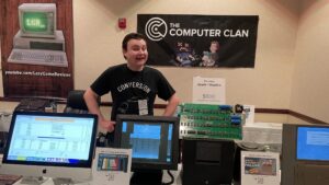 A picture of Krazy Ken behind some rare and retro tech.